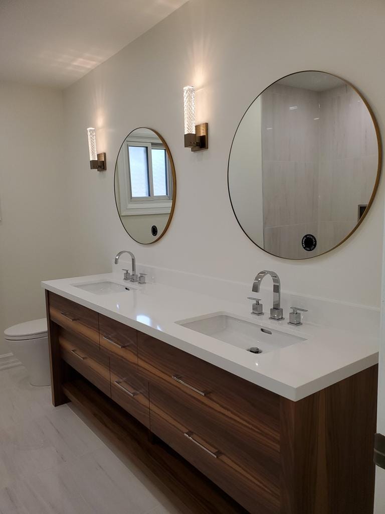 bathroom renovation in Pickering featuring double vanity with quartz counter top