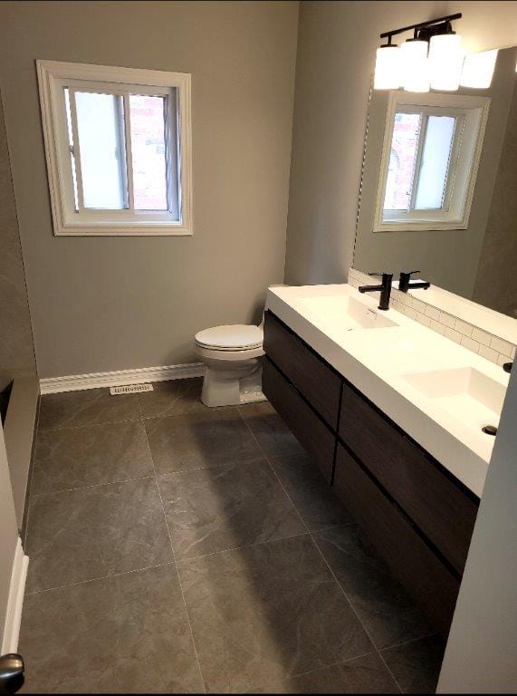 Contemporary bathroom makeover with black matte fixtures and a modern floating vanity.